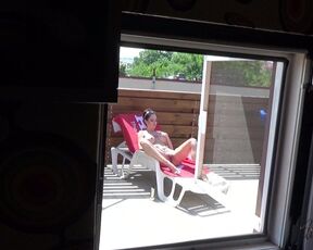 Spy my hot neighbor woman while she tan her beautiful body.